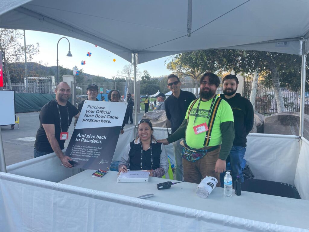 Pasadena Jaycees volunteers at a tent in the Rose Bowl Stadium